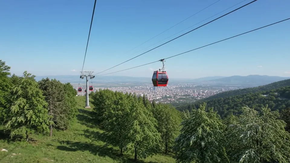 Cable car rising above Bursa forests with a mountain landscape